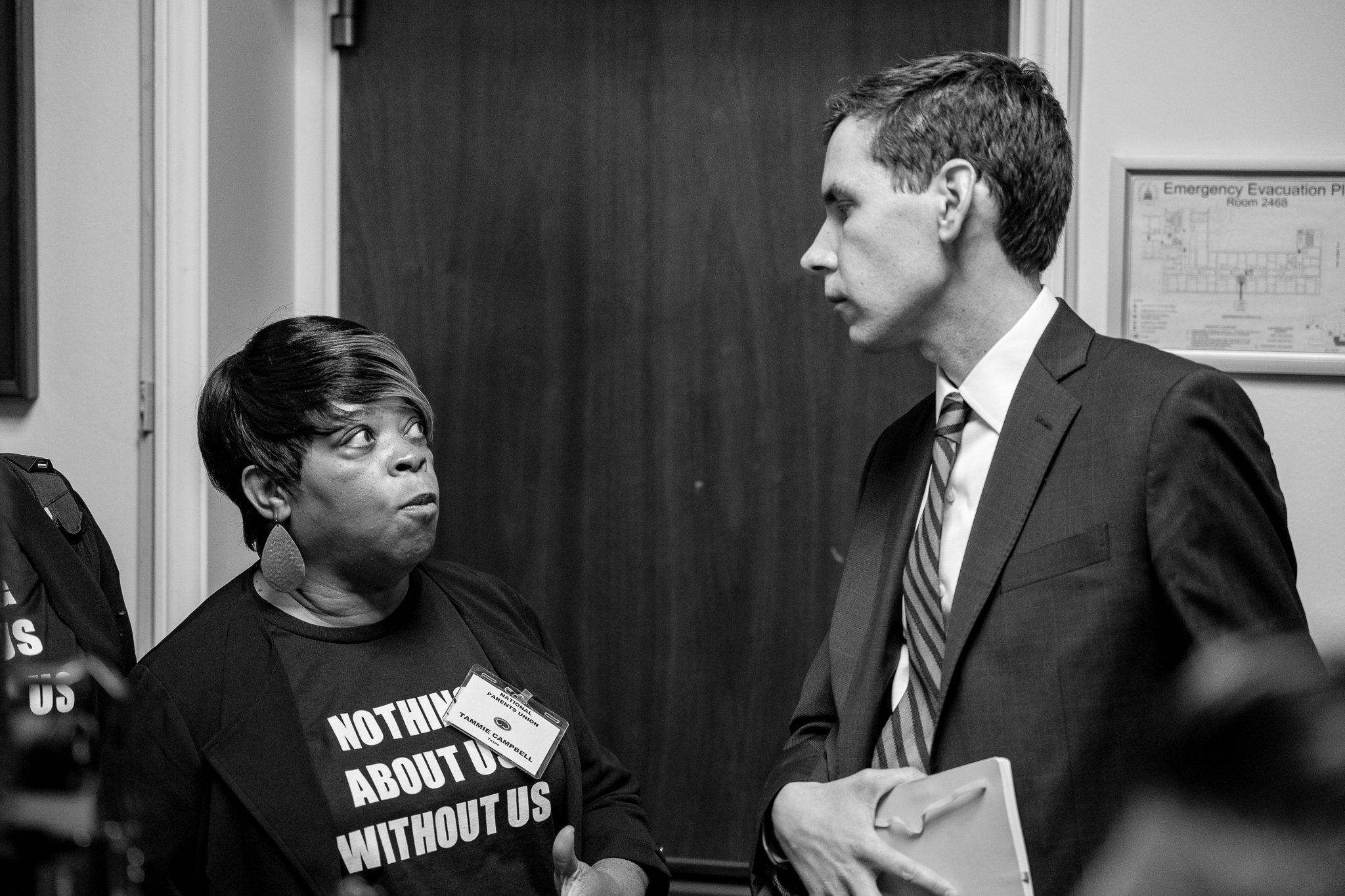 A delegate of the National Parents Union Speaks with a Staffer for House Speaker Kevin McCarthy